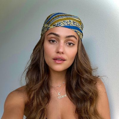 Clara Wilsey taking a selfie with a bandana for her Instagram.